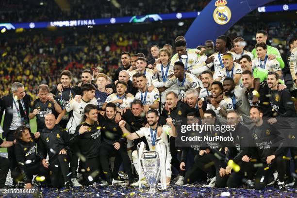 Real Madrid players are celebrating with the trophy after the UEFA Champions League Final match between Real Madrid and Borussia Dortmund at Wembley...