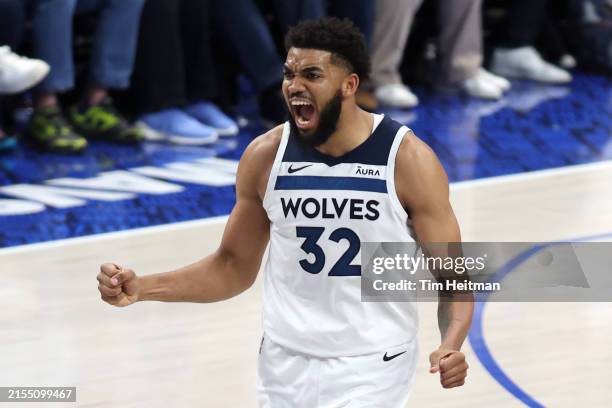 Karl-Anthony Towns of the Minnesota Timberwolves celebrates a basket during the second half against the Dallas Mavericks in Game Four of the Western...
