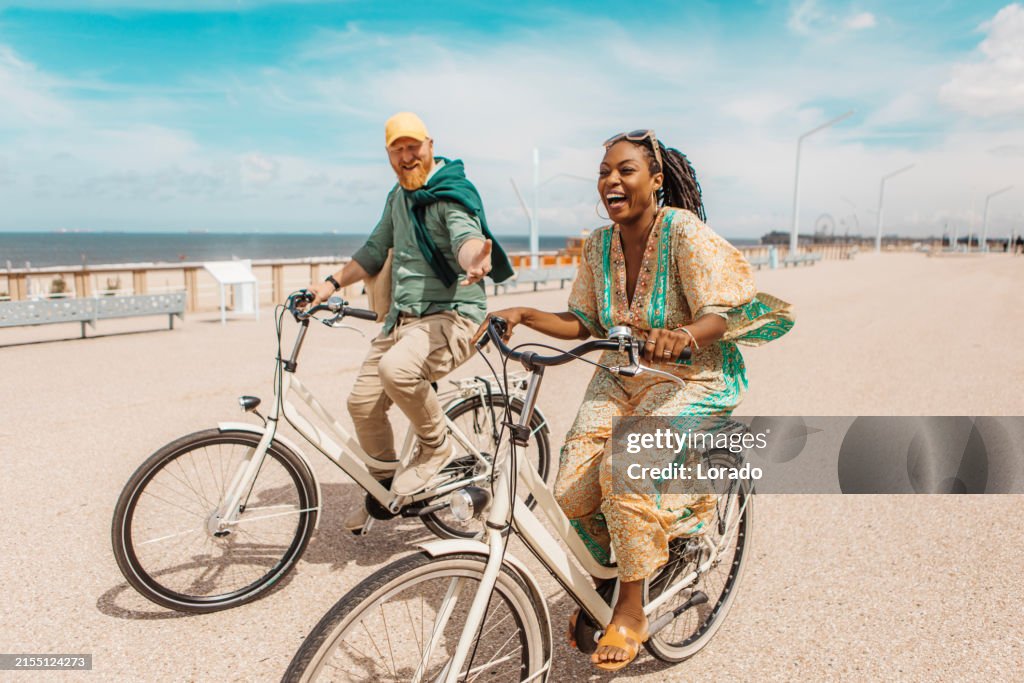 Mixed Riding Beautiful Senior Mixed Race Couple Enjoying A Bike Ride High-Res Stock ...