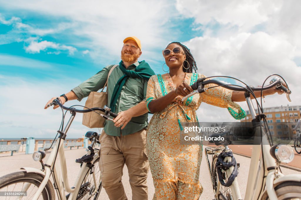 Mixed Riding Beautiful Senior Mixed Race Couple Enjoying A Bike Ride High-Res Stock ...