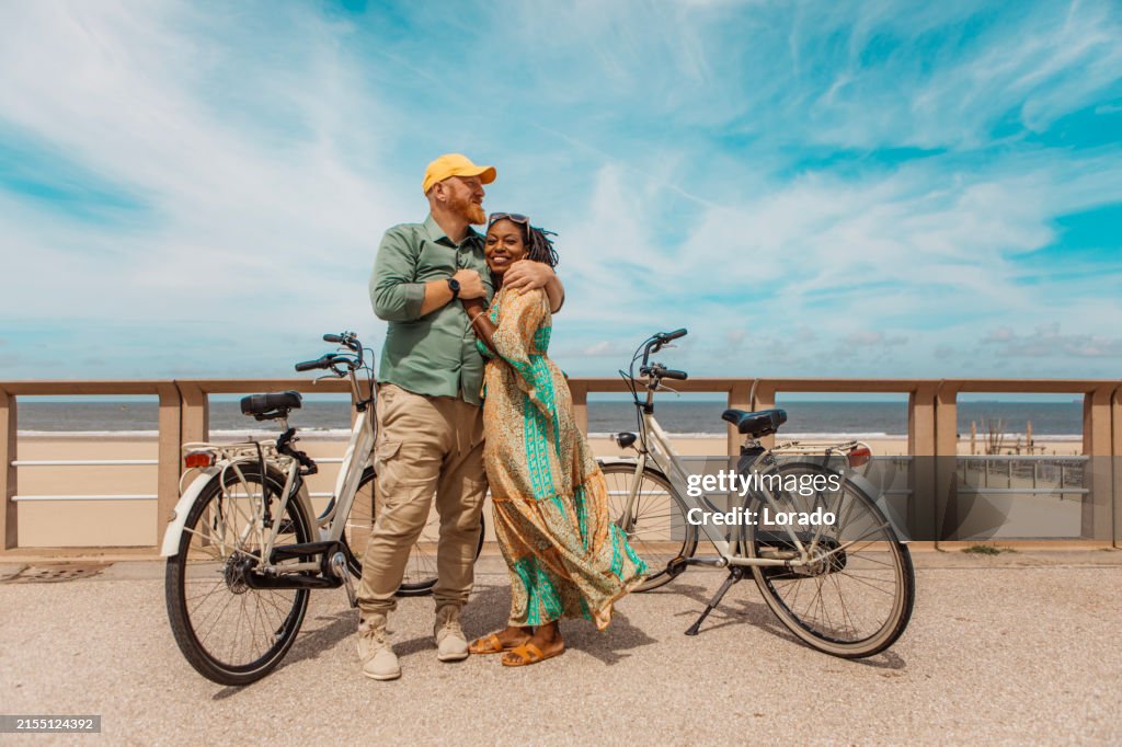 Mixed Riding Beautiful Senior Mixed Race Couple Enjoying A Bike Ride High-Res Stock ...