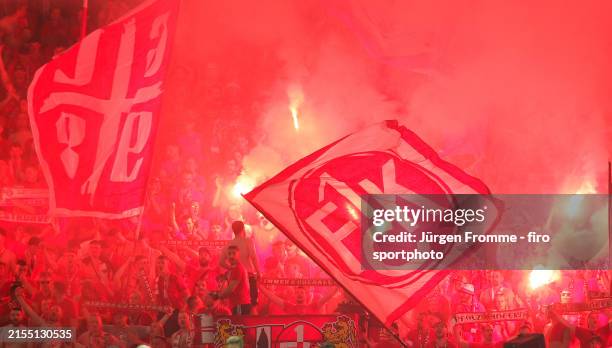 Fans of 1.FC Kaiserslautern with fireworks and pyrotechnics in the Olympic Stadium during the DFB Cup 2023/24 final match between 1. FC...