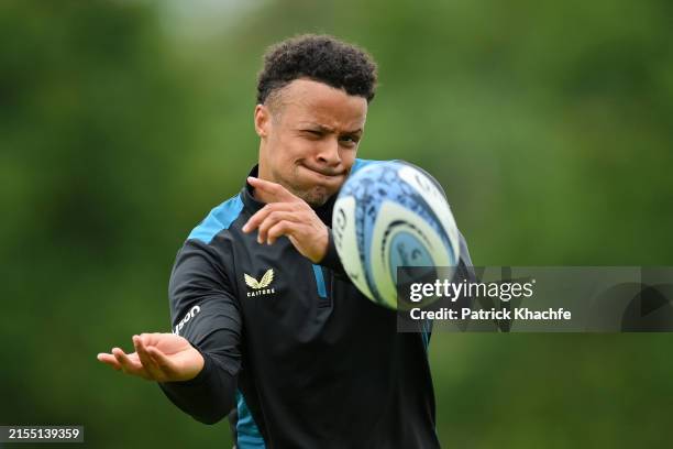 Regan Grace of Bath Rugby passes a ball during a Bath Rugby training session at Farleigh House on May 28, 2024 in Bath, England.