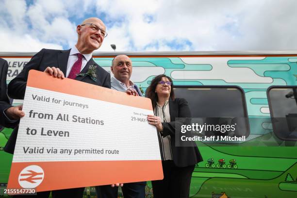 Leader, John Swinney poses with a giant train ticket as he attends the official opening of the Levenmouth Rail Link on May 29, 2024 in Leven,...