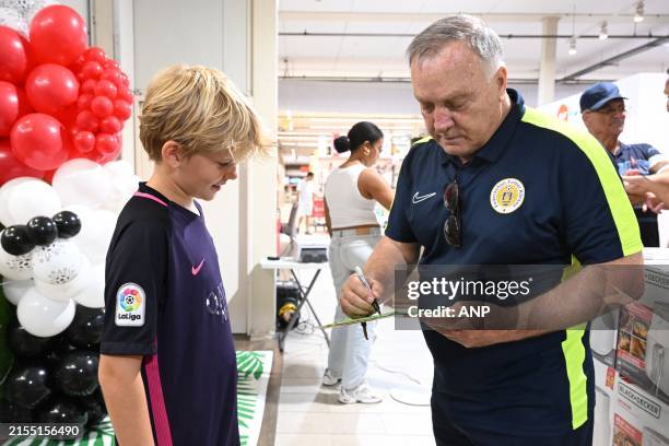 Curacao coach Dick Advocaat signs for a Curacao supporter during a Meet and Greet Curacao supporters June 2 in the Building Loket Willemstad,...