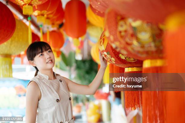 asian traveler woman is enjoy looking lanterns in chinatown kuala lumpur. malaysia chinese lunar new year - chinese lanterns for sale stock pictures, royalty-free photos & images