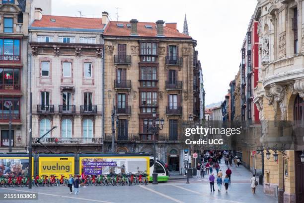 Arriagako Enparantza with Tram and crowds entering Casco Viejo area , Bilbao, Basque, Spain.