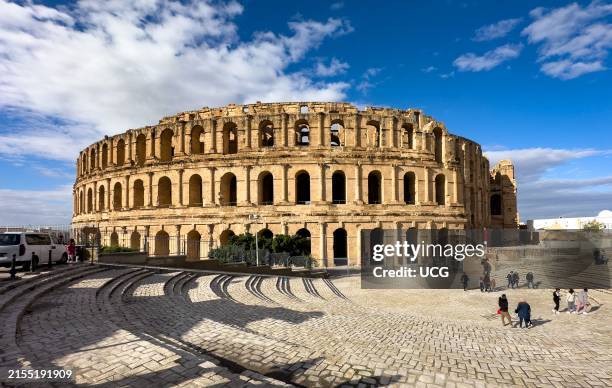 The exterior of the well-preserved Roman amphitheater in El Jem, Thysdrus, Tunisia seen from the southeast.