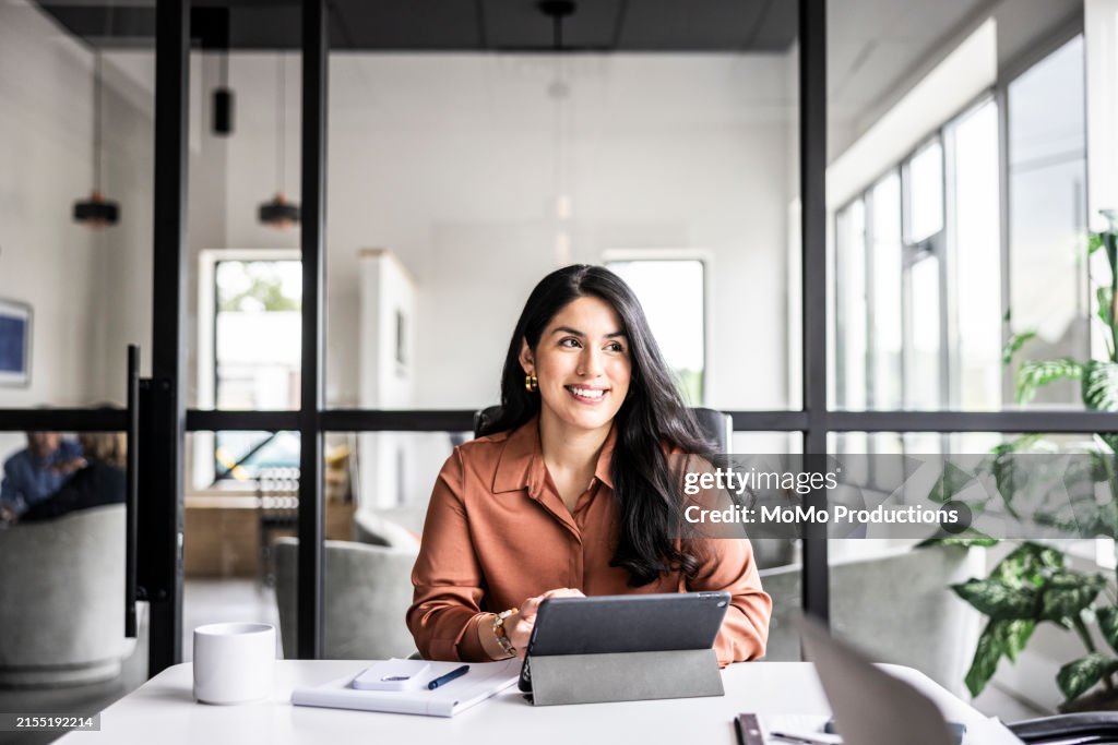 Portrait of businesswoman in modern conference room