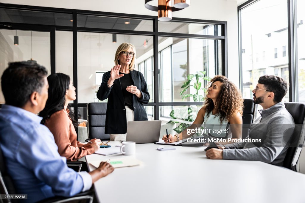 Business colleagues meeting in modern conference room