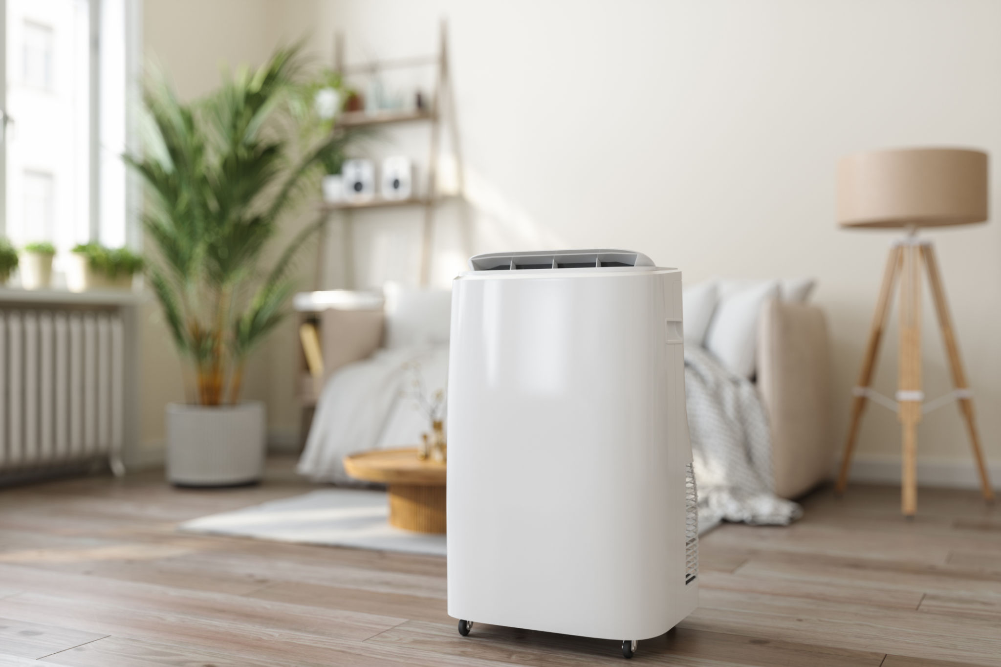 Close-up View Of Portable Air Conditioner With Blurred Living Room Background Close-up View Of Portable Air Conditioner With Blurred Living Room Background