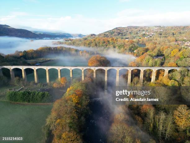 pontcysyllte aqueduct, the river dee and morning mist - aqueduct stock pictures, royalty-free photos & images