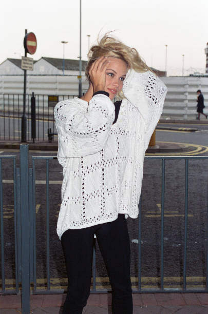 Pamela Anderson, Canadian American actress and model, pictured outside terminal at London Heathrow Airport, Tuesday 19th January 1993, in UK to...