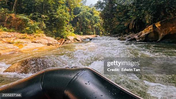 extreme sports point of view front seat rafting on whitewater tropical river - whitewater river stockfoto's en -beelden