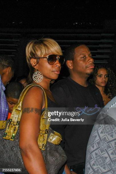 Singer Mary J. Blige, her husband and manager Kendu Isaacs, and singer Starshell backstage during the Hot 107.9 Birthday Bash 14 at Phillips Arena on...
