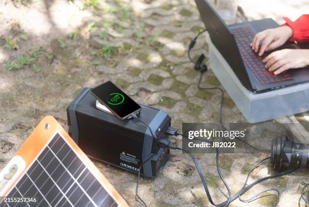 portable solar power charging setup for outdoor work - battery life stock pictures, royalty-free photos & images