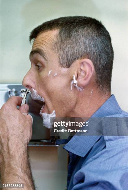 Astronaut Eugene Cernan shaves aboard the USS Wasp, June 6th 1966. Cernan had spent three days orbiting Earth aboard Gemini 9 before being retrieved...