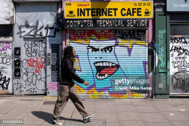 Smart Internet Cafe in Dalston with shutetrs down on 8th May 2024 in London, United Kingdom. Internet cafes were once very popular at the beginning...