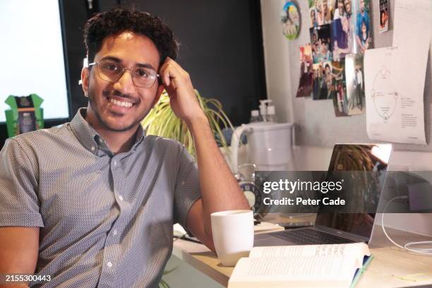 student in bedroom looking at camera - laptop table top stock pictures, royalty-free photos & images