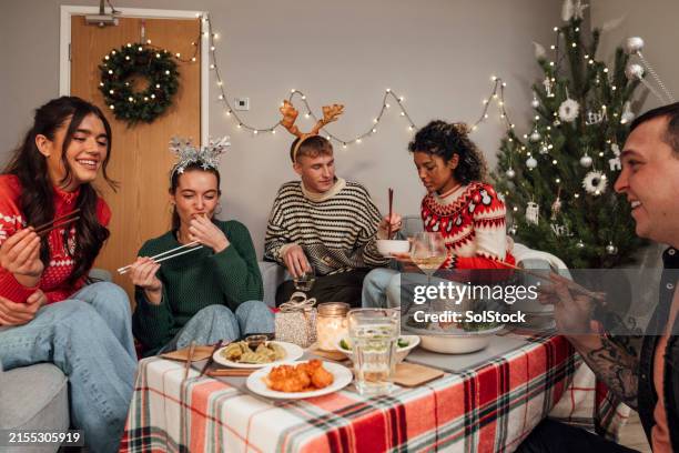 enjoying asian food at christmas - christmas asian food stock pictures, royalty-free photos & images