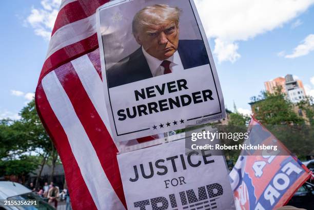 Poster of former President Donald Trump is held by one of his supporters after he was found guilty on all counts at Manhattan Criminal Court on May...