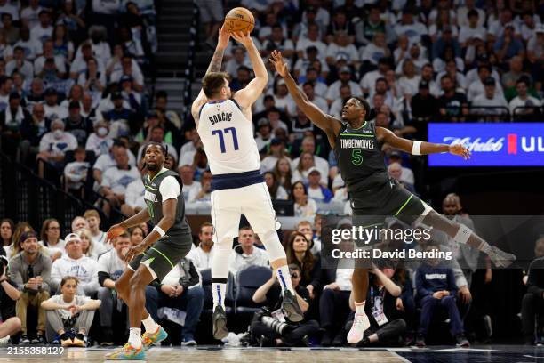Luka Doncic of the Dallas Mavericks shoots the ball against Anthony Edwards of the Minnesota Timberwolves during the second quarter in Game Five of...