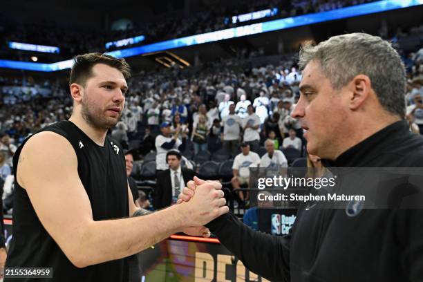 Luka Doncic of the Dallas Mavericks shakes hands with assistant coach Micah Nori of the Minnesota Timberwolves after Game Five of the Western...