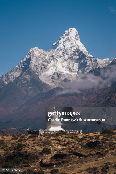 white stupa in front of ama dablam mountain in everest national park, nepal - himalayas stock pictures, royalty-free photos & images