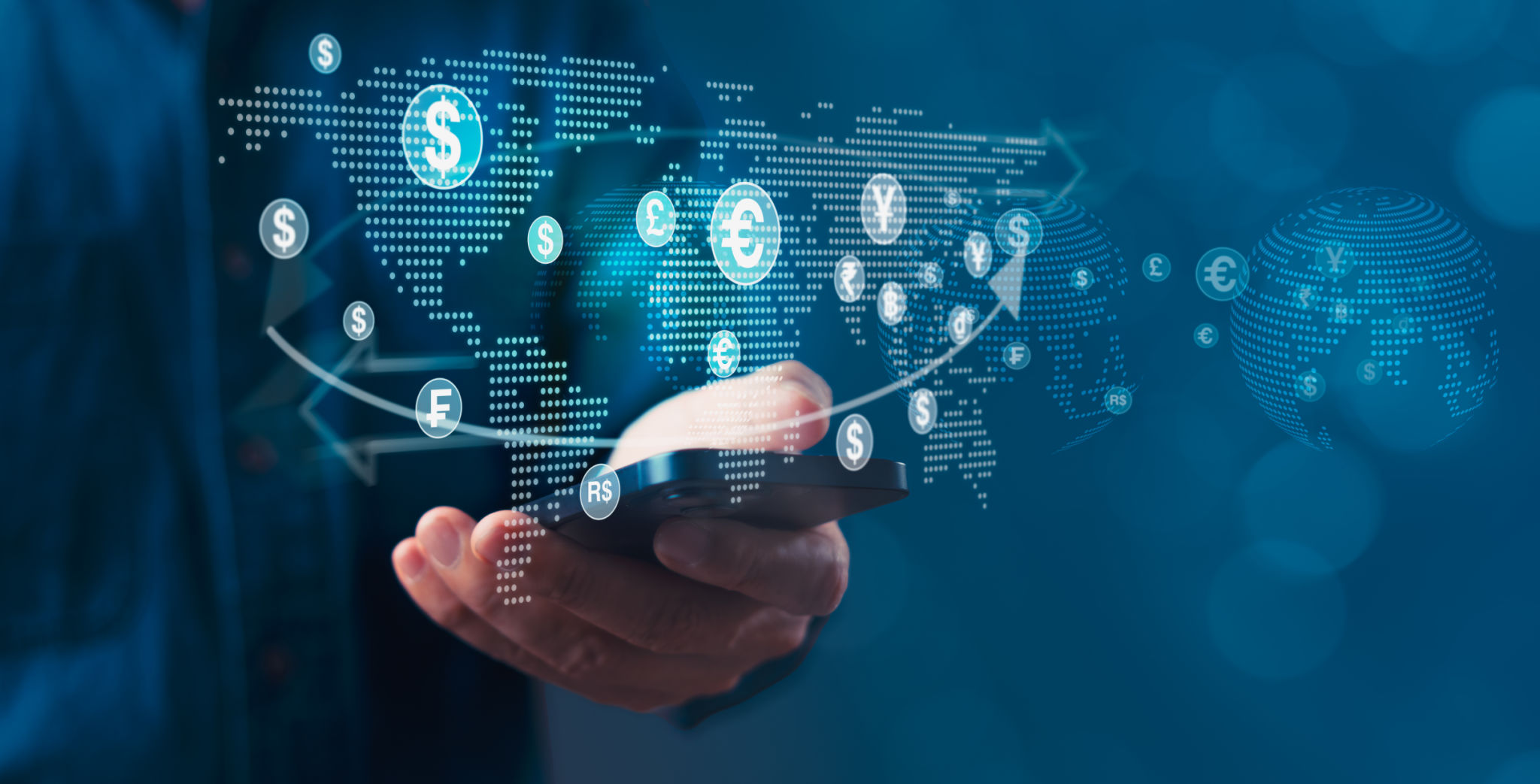A person is holding a cell phone and showing a map of the world with money symbols on it A person is holding a cell phone and showing a map of the world with money symbols on it