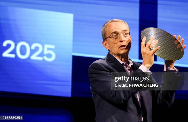 Intel CEO Pat Gelsinger holds a sample of a wafer during his keynote speech at Computex 2024 in Taipei on June 4, 2024.