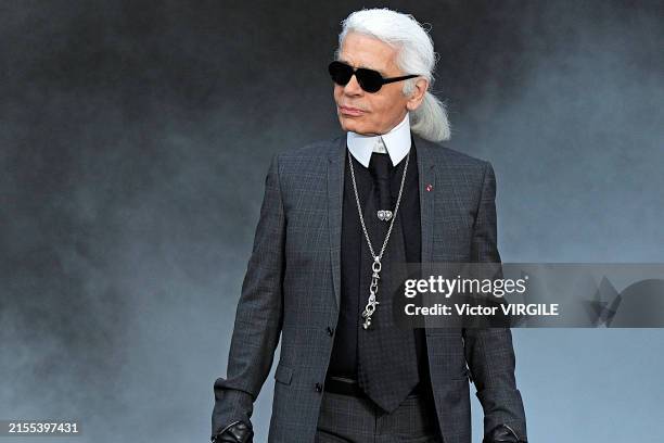 Fashion designer Karl Lagerfeld walks the runway at the Chanel Ready to Wear Fall/Winter 2011-2012 fashion show during the Paris Fashion Week on...