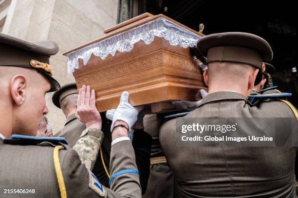 Soldiers of the honor guard carry a coffin of Petro Franko during the farewell ceremony at the Saint Peter and Paul Garrison Church on May 30, 2024...