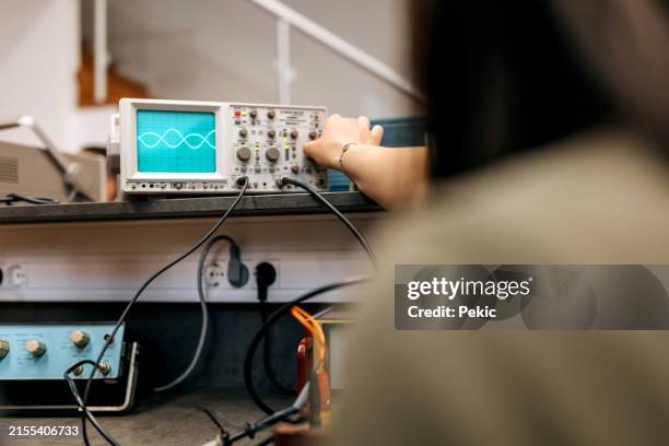engineering student using oscillograph at the classroom - oscilloscope lab stock pictures, royalty-free photos & images