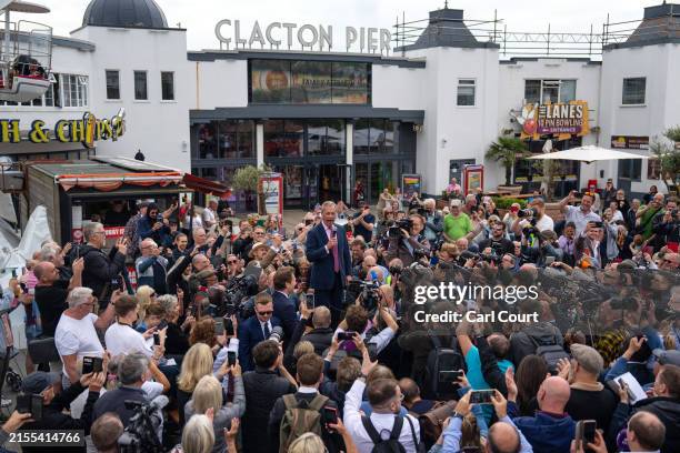 Reform UK party leader Nigel Farage speaks to supporters as he launches his election candidacy at Clacton Pier on June 4, 2024 in Clacton-on-Sea,...