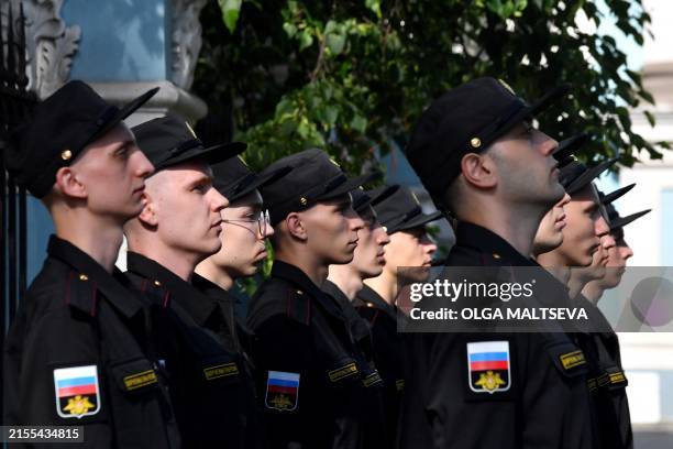 Russian navy recruits attend a ceremony marking the departure of recruits to join the army, in Saint Petersburg on June 4, 2024.
