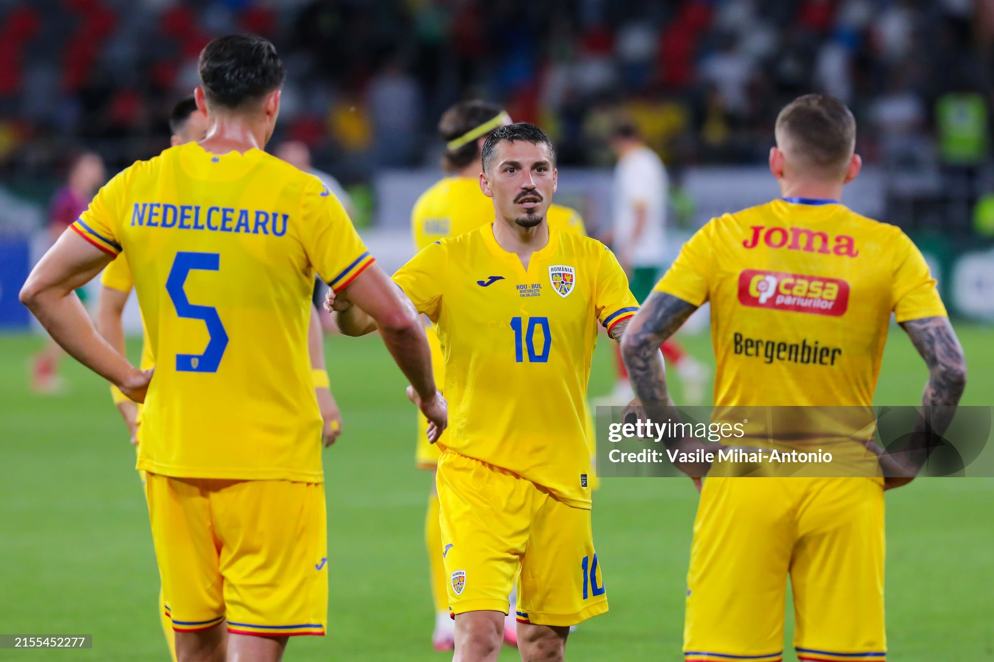 BUCHAREST, ROMANIA - JUNE 04: Nicolae Stanciu (C) of Romania talks with his teammates during the international friendly match between Romania and Bulgaria at Stadionul Steaua on June 04, 2024 in Bucharest, Romania. (Photo by Vasile Mihai-Antonio/Getty Images)