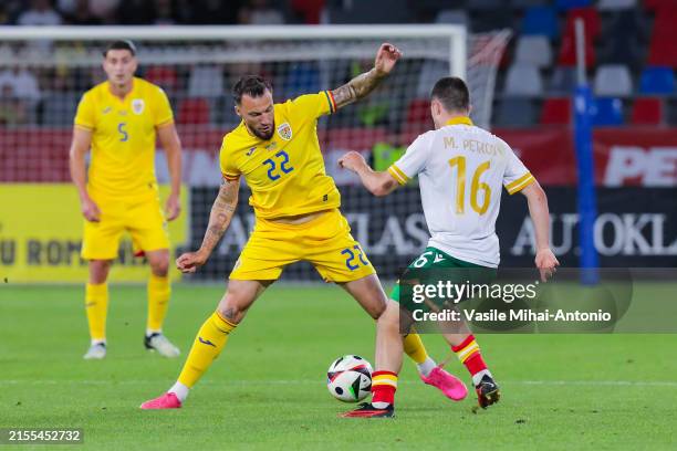 Vasile Mogos of Romania competes for the ball with Marin Petkov of Bulgaria during the international friendly match between Romania and Bulgaria at...