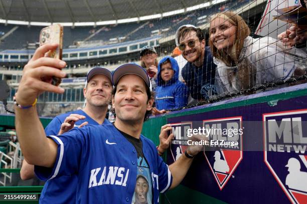 Actors Paul Rudd and Jason Sudeikis pose for a photograph with fans prior to a game between the San Diego Padres and Kansas City Royals at Kauffman...