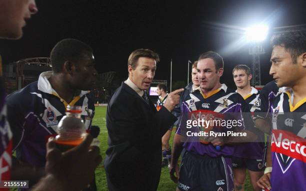 Storm Coach Craig Bellamy addresses his players after the round 18 NRL match between the Melbourne Storm and the North Queensland Cowboys at Olympic...