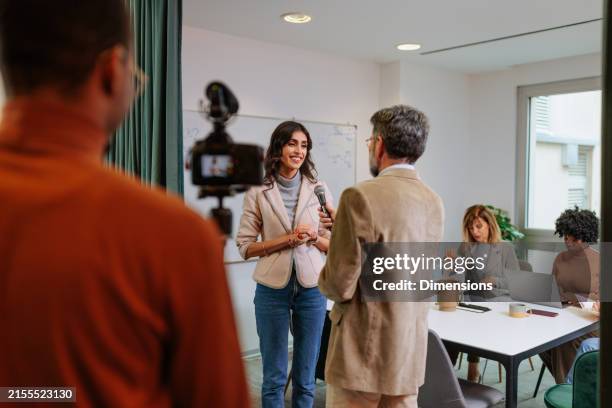company spokesperson giving an interview - spokesperson stock pictures, royalty-free photos & images