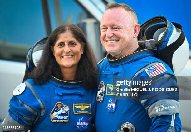 Astronauts Butch Wilmore and Suni Williams, wearing Boeing spacesuits, depart the Neil A. Armstrong Operations and Checkout Building at Kennedy Space...