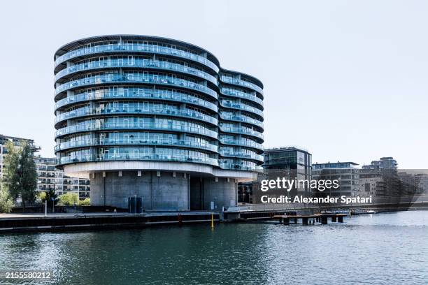 new modern apartment buildings along the canal in copenhagen, denmark - danish architecture stock pictures, royalty-free photos & images