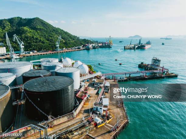 drone view of oil tanks at tsing yi, hong kong - gas refinery stock pictures, royalty-free photos & images