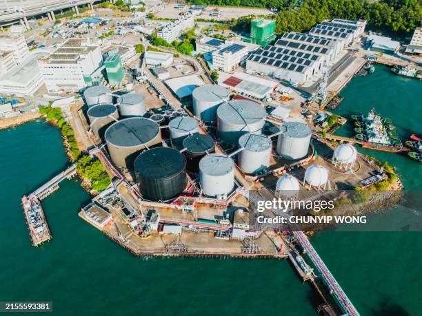 drone view of oil tanks at tsing yi, hong kong - gas refinery stock pictures, royalty-free photos & images