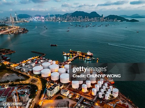 Tank ship loading unloading oil and gasoline at Commercial dock in sea Tank ship loading unloading oil and gasoline at Commercial dock in sea