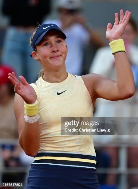 Mirra Andreeva acknowledges the crowd after winning match point against Aryna Sabalenka of Belarus during the Women's Singles Quarter Final match on...