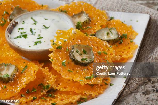 crispy cheddar cheese dill pickle crisps - dill pickle stock pictures, royalty-free photos & images