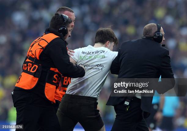 Pitch invader is seen during the UEFA Champions League 2023/24 final match between Borussia Dortmund v Real Madrid CF at Wembley Stadium on June 01,...