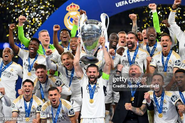 Nacho Fernandez of Real Madrid lifts the UEFA Champions League Trophy after his team's victory after the UEFA Champions League 2023/24 Final match...