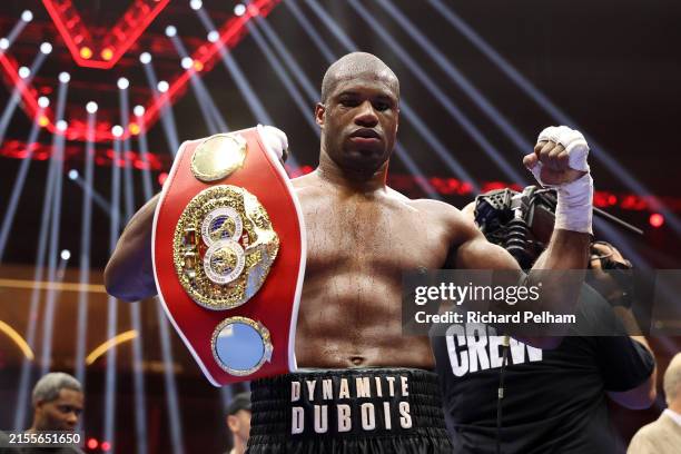 Daniel Dubois of Team Queensberry poses for a photo with his title belt after victory over Filip Hrgovic of Team Matchroom following the Heavyweight...
